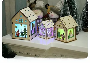 Three illuminated wooden Christmas houses with LED lights and reindeer cutout designs