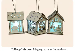 Three LED wooden Christmas house ornaments hanging on a tree with cold blue light