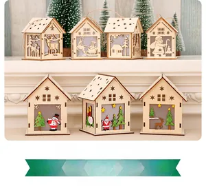 Detail show of glowing wooden Christmas house ornaments with reindeer and Santa designs