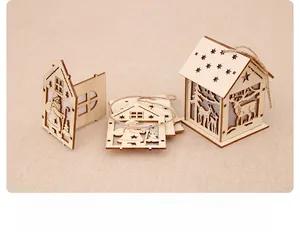 Macro view of DIY wooden Christmas cottage showing detailed laser-cut reindeer patterns