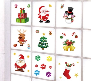 Detail of Santa and snowman electrostatic glass stickers on white tile background