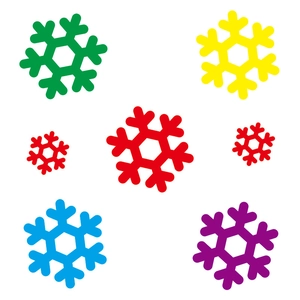 Close-up of colorful snowflake window stickers in green yellow red and blue colors