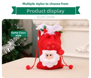 Detail of red Santa Claus felt gift bag with 3D design by a Christmas tree fireplace