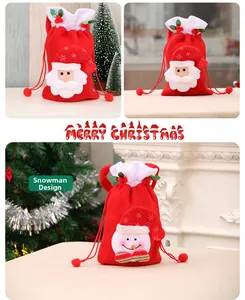 Detailed view of red velvet Christmas drawstring gift bags with 3D Santa and Snowman patches