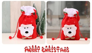 Detail of red plush Christmas drawstring bag with 3D polar bear and white fur trim