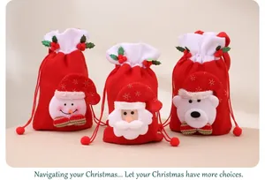 Detailed view of three red Christmas drawstring gift bags with Santa, snowman and bear appliques