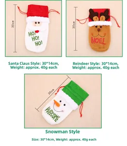 Detailed view of Christmas wine bottle gift bags with drawstring and holiday motifs