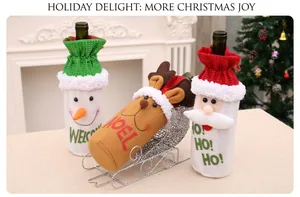 Detailed view of Santa, Snowman, and Reindeer wine bottle covers with sled stands