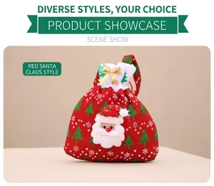 Detail of red velvet Christmas gift bag with 3D Santa Claus and snowflake patterns