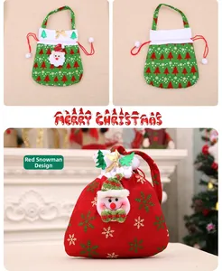 Detail of red snowman Christmas gift bag with gold embroidery and plush drawstring handle