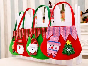 Detailed view of four felt Christmas gift bags featuring snowman and Santa designs