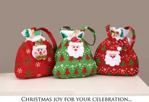 Detail view of plush Santa and Snowman drawstring gift bags with golden ribbons