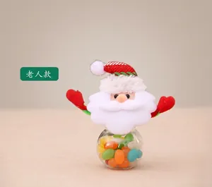 Detailed view of mini Santa Claus candy jar with red striped hat and clear container