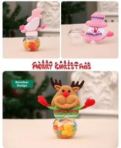 Detail of Christmas candy jar with plush reindeer and snowman character lids and transparent base