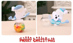 Detail of Christmas candy jar featuring a white bear with blue hat on transparent ball