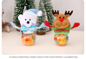 Detail of Christmas candy jars featuring bear and reindeer designs with colorful sweets