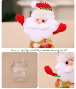 Detail of Santa Claus plush cap and transparent Christmas candy jar with festive decor