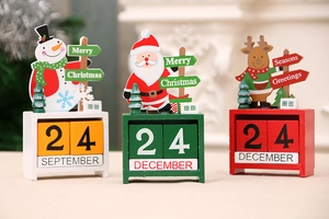 Three-piece wooden Christmas advent calendar set featuring Santa, snowman, and reindeer