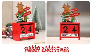 Detail of Christmas wooden advent calendar with reindeer decor and date blocks