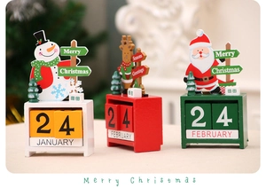 Macro detail of wooden Christmas countdown calendar featuring festive snowman and reindeer figurines