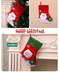 Detail showing 3D Santa and Snowman Christmas stockings with sequins hanging on fireplace