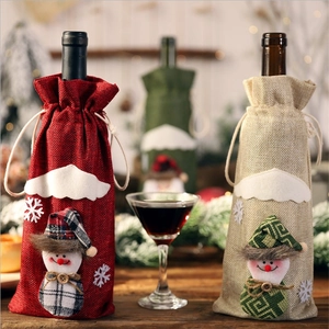 Three-piece burlap Christmas wine bottle covers with plush snowman and snowflake embroidery