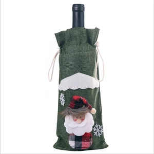 Christmas burlap wine bottle bag featuring a 3D Santa Claus with red plaid hat decor