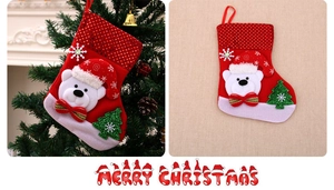 Detail of red Christmas stocking with 3D white bear, sequins and festive hanging loop