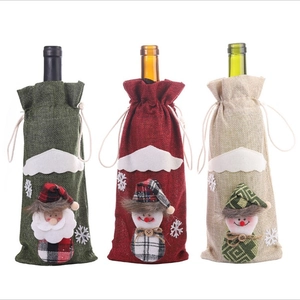 Set of 3 Christmas wine bottle covers with Santa and snowman designs in linen-like fabric