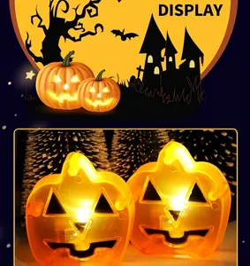 Macro detail of LED Jack-o'-lantern pumpkin lamp showing orange glowing light effect