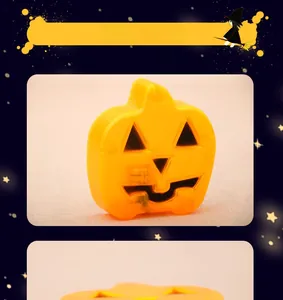 Macro detail of a flat orange pumpkin LED light with a carved face for Halloween decor