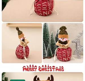 Detail of Christmas burlap gift bag featuring a 3D snowman doll and festive JOY typography