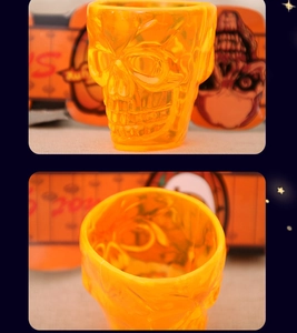 Macro view of translucent orange skull cup with detailed bone structure for Halloween