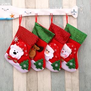 Set of 4 festive Christmas stockings with Santa, Reindeer, Snowman, and Polar Bear figures
