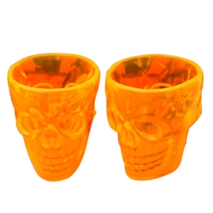 Set of two orange skull-shaped Halloween cups made of transparent resin for party decor