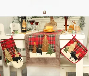 Christmas kitchen set with plaid oven mitts, mat and table runner with reindeer motifs