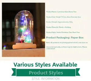 Detailed view of the 14.5cm glowing glass dome with Santa and tree inside