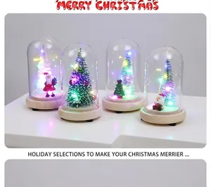 Macro view of four mini Christmas trees in glass cloches with warm LED lights and wooden base
