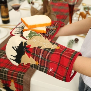 Christmas oven mitt and pot holder set with plaid patterns and festive reindeer applique