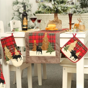 Christmas kitchen set with plaid table runner, insulated glove, and mat featuring reindeer