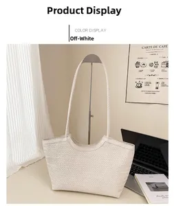 Detail of minimalist cream woven tote bag in a cozy home office setting with laptop