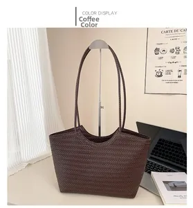 Close-up of dark brown tote bag featuring detailed V-shape woven texture and leather straps