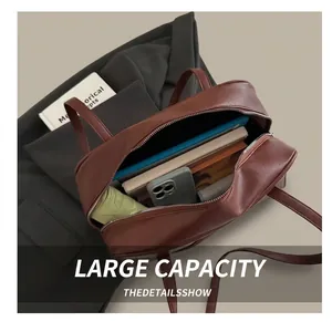 Interior view showing the large capacity of the brown faux leather tote with daily items