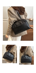 Macro view of black PU leather shoulder bag featuring metal zipper and thin dual straps