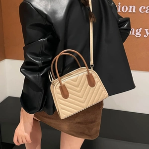 Minimalist beige crossbody bag with V-quilted faux leather and brown contrast handle