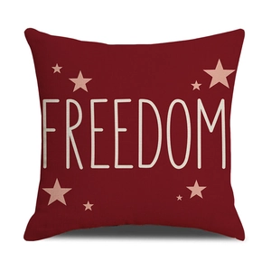 Dettaglio della fodera per cuscino in lino con scritta Freedom bianca e stelle