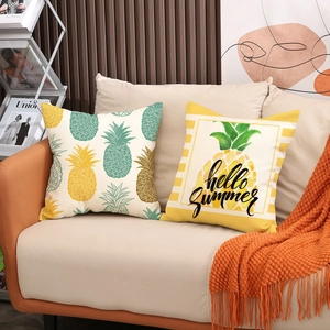 Nordic pineapple pattern pillow covers with Hello Summer text on a beige sofa