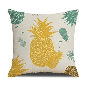 Close-up of tropical pineapple print on off-white cotton linen cushion cover