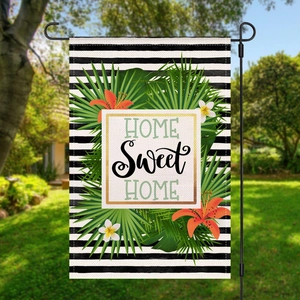 Garden flag with tropical floral design and Home Sweet Home text on black stripes