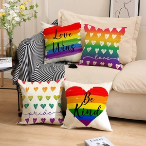 Set of four linen rainbow pride cushion covers with Love Wins and Be Kind prints